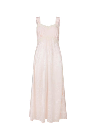 A pale blush pink sleeveless maxi dress with a textured, slightly sheer fabric and delicate lace trim at the neckline and upper bodice, shown against a plain white background.